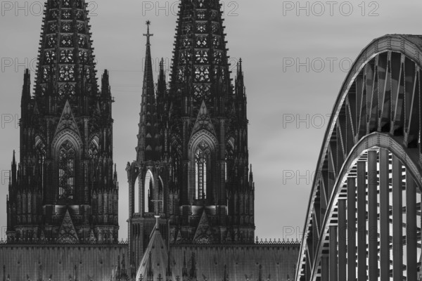 Evening atmosphere, Cologne Cathedral illuminated with LED lamps and the Hohenzollern Bridge, Cologne, North Rhine-Westphalia, Germany
