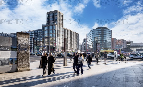 Wall segment, tourists and passers-by at Potsdamer Platz, Berlin, Germany