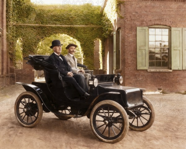 Thomas Edison and Mr. Greenfeldt in a Baker electric automobile, 1910, digitally edited