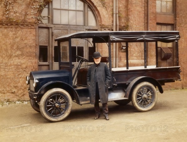 Thomas Alva Edison inspecting a Lansden Electric truck which used Edison batteries, digitally edited