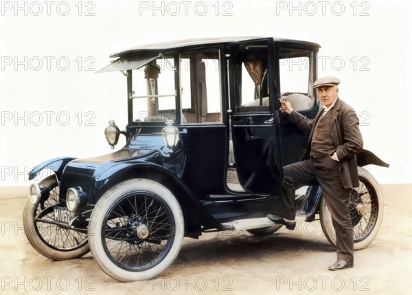 Thomas Alva Edison, 1847 - 1931, American inventor, with Detroit Electric automobile, 1913, digitally edited