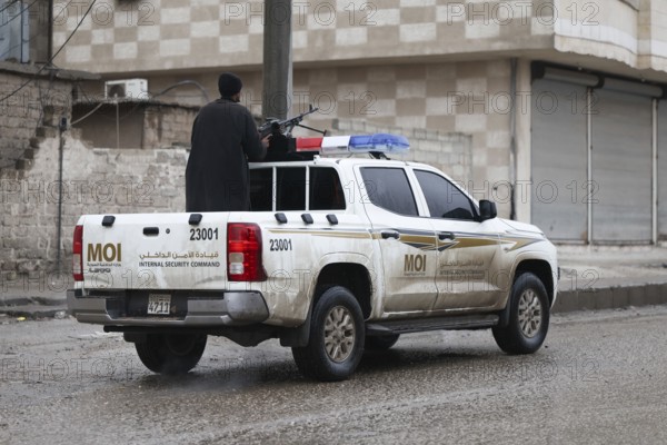 In Al Tabqah, Syria on January 18, 2026, a convoy of Syrian Government forces deploys throughout the city following the withdrawal of SDF forces. Local civilians are seen gathering in the streets to welcome the troops with celebrations, marking the return of government control to this strategic city in northeast Syria, Raqqa, Tabqah, Syria