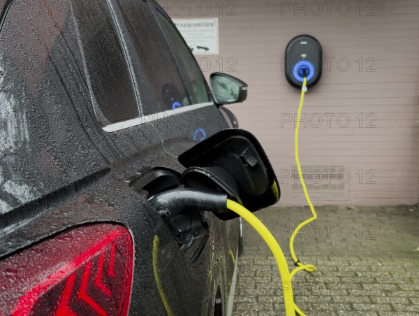 An e-car is charged at a wallbox, Wuppertal, Germany