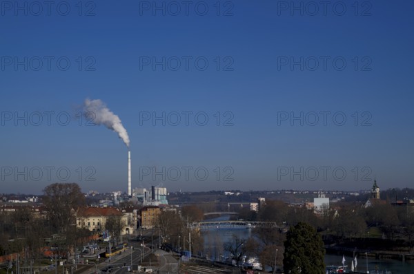 View of EnBW power plant and waste incineration plant Stuttgart-Münster, combined heat and power plant, smoke from chimney, Neckar, Mühlsteg, viaduct, Protestant City Church, Bad Cannstatt, Stuttgart, Baden-Württemberg, Germany