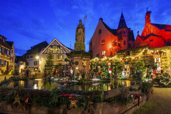 Houses illuminated and decorated for Christmas, Christmas market, blue hour, Eguisheim, Haut-Rhin department, Grand Est region, Alsace, France