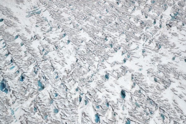 Aerial view of meltwater on the Greenland ice sheet, Arctic landscape, frozen wilderness, glaciers and snow-covered terrain, Climate change, Global warming, Greenland, North America