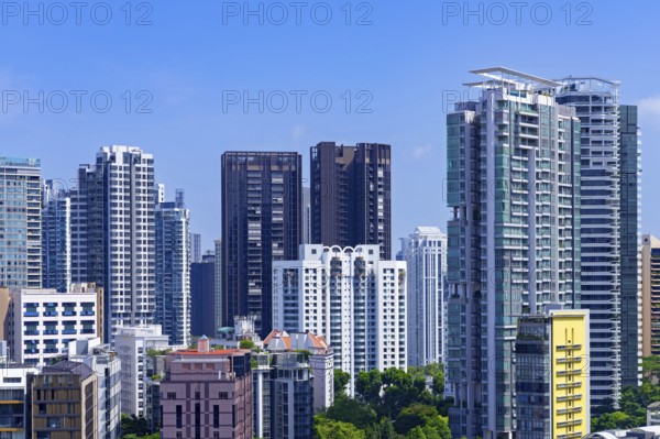 Skyline showing residential high-rise buildings and skyscrapers with flats and apartments in the city Singapore, Southeast Asia