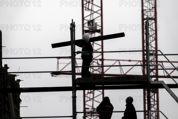 Construction site, scaffolding work on a large construction project, apartments and commercial premises, symbolic image of the construction industry
