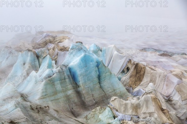 Rhone Glacier covered to protect it from melting, highlighting climate change and global warming, Oberwald, Goms, Valais Canton, Switzerland