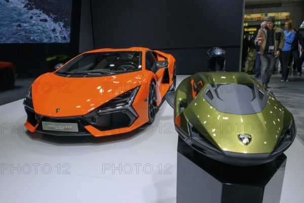 Press photo from left Lamborghini Revuelto plug-in hybrid super sports car with 1015 hp system output thanks to 6.5 liter naturally aspirated V12 engine with 825 hp and three electric motors, right underwater scooter Seabob produced by German manufacturer CAYAGO AG in cooperation with Automobili Lamborghini, Messe boot, Düsseldorf, North Rhine-Westphalia, Germany