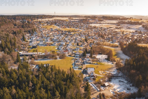 View of a small town in winter with snow-covered forests and fields, Hallwangen, Freudenstadt district, Germany