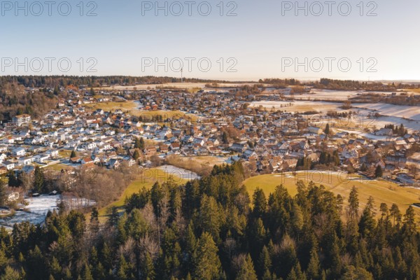 Snowy village landscape with adjacent forest and soft colors, Hallwangen, Freudenstadt district, Germany