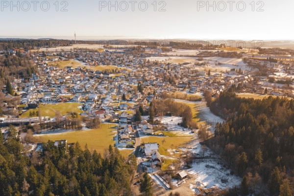 A village surrounded by forest and hills, with snow-covered areas and a river in winter, Hallwangen, Freudenstadt district, Germany