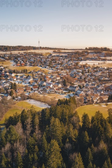 Snow-covered landscape with village and adjacent forest in a wintry atmosphere, Hallwangen, Freudenstadt district, Germany