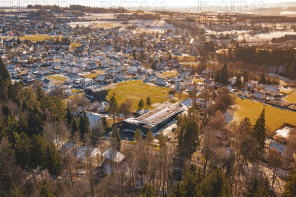 Winter landscape of a small town with snow-covered roofs and surrounding fields, Hallwangen, Freudenstadt district, Germany