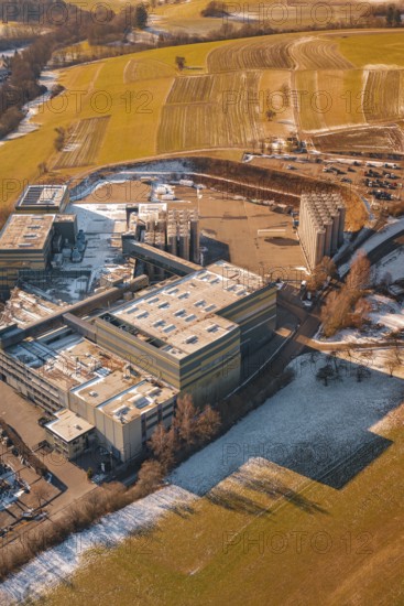 Industrial site in wintry snowy fields and simple countryside, Hallwangen, Freudenstadt district, Germany