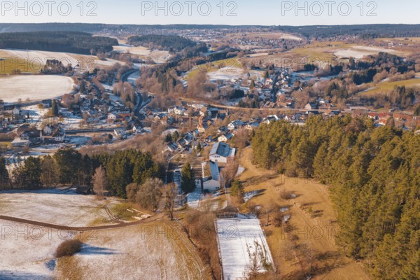Extensive winter landscape with a village and surrounding fields under clear skies, Aach, Dornstetten, Freudenstadt district, Germany
