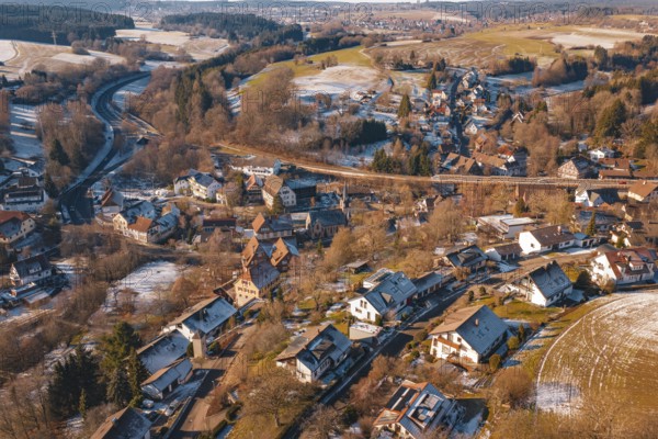 Snow-covered village spread over vast countryside with roads and forests, Aach, Dornstetten, Freudenstadt district, Germany