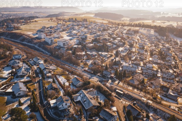 Snowy roofs of a village seen from above in a wintry landscape, Aach, Dornstetten, Freudenstadt district, Germany