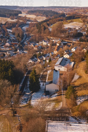 Small settlement with snow-covered houses and roads, surrounded by forest landscape, Aach, Dornstetten, Freudenstadt district, Germany