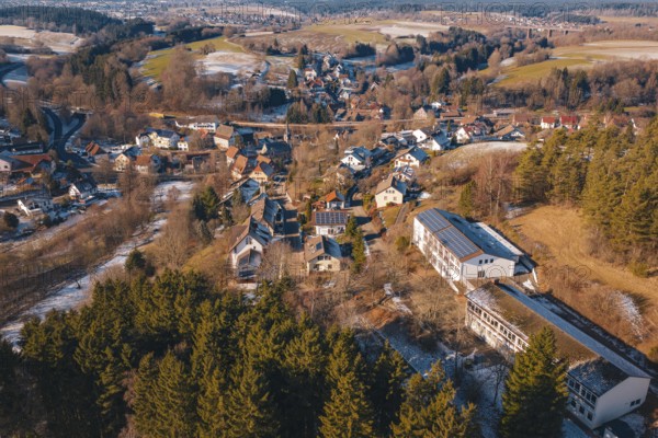 Panoramic view of a snowy village nestled in a hilly forest landscape, Aach, Dornstetten, Freudenstadt district, Germany