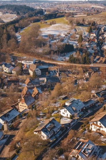Snowy village in hilly surroundings taken from the air on a clear day, Aach, Dornstetten, Freudenstadt district, Germany