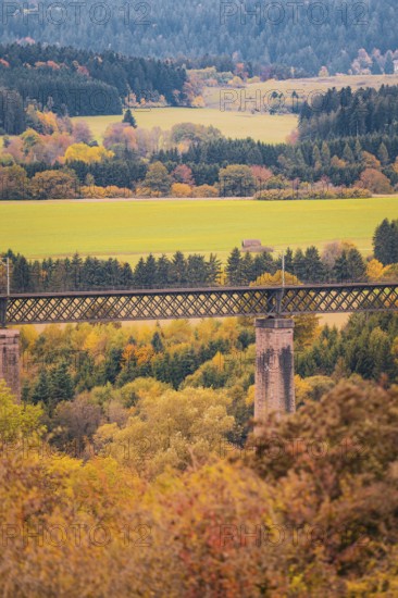 Autumn landscape with a bridge over wooded hills and fields, Dornstetten, Freudenstadt district, Germany