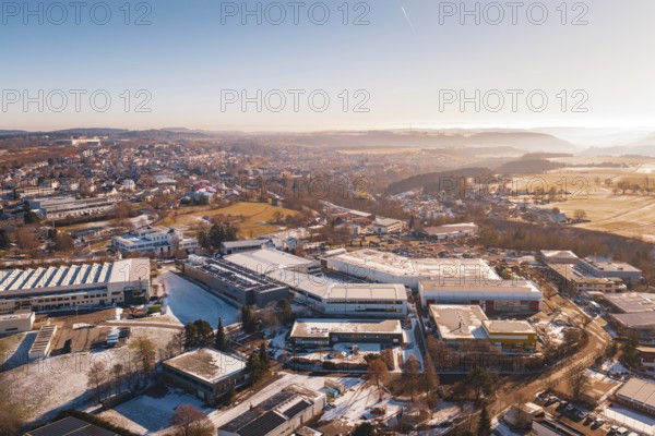 Aerial view of a wintery cityscape with buildings and fields in morning light, Dornstetten, Freudenstadt district, Germany