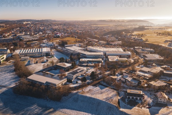 City view in winter with various buildings and gentle sunrise, Dornstetten, Freudenstadt district, Germany