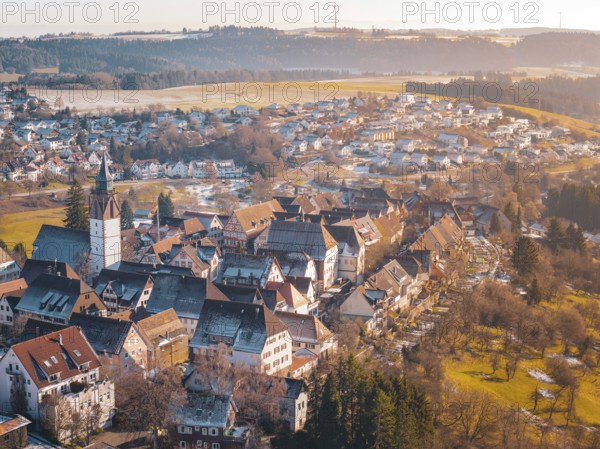 City view from the air with church and greenery, surrounded by rural landscape, Dornstetten, Freudenstadt district, Germany