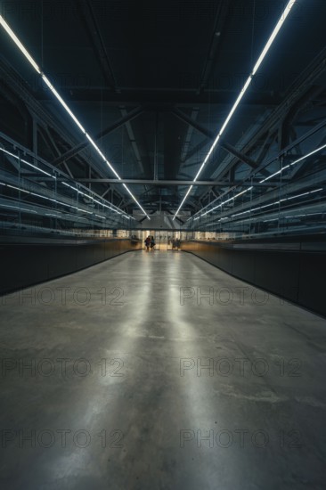 Futuristic corridor with strong lighting and reflections, Tate Modern of Art, Lodon, United Kingdom