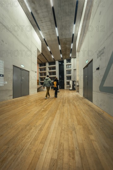 Bright modern interior with wooden floor and multiple doors, Tate Modern of Art, Lodon, United Kingdom