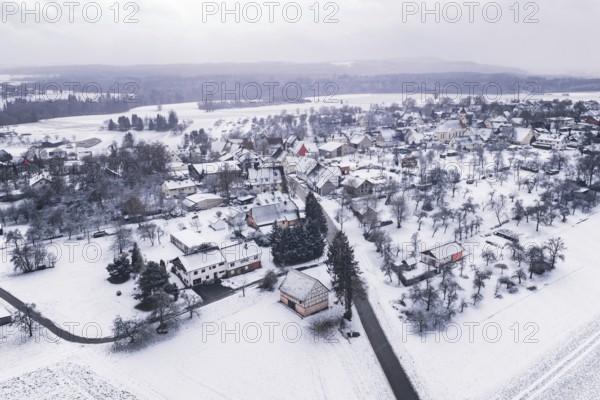 Snowy village in a wintry landscape, surrounded by trees and fields, Wiesenstetten, Freudenstadt district, Germany