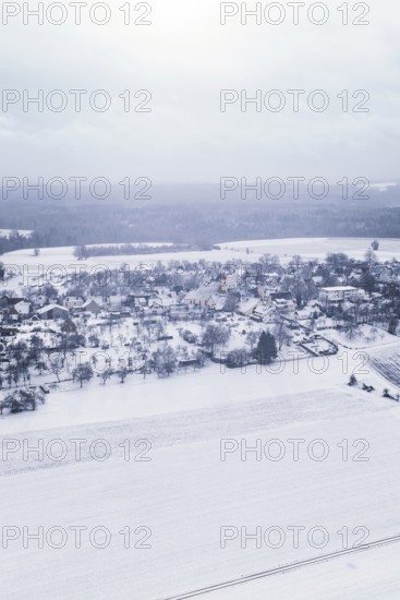 Snowy village in winter landscape with fields and trees, Wiesenstetten, Freudenstadt district, Germany