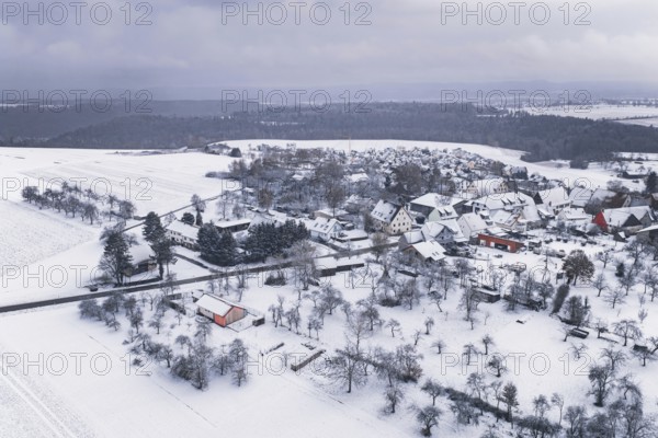 Wintery village landscape with snow-covered houses and trees, cold atmosphere, Wiesenstetten, Freudenstadt district, Germany
