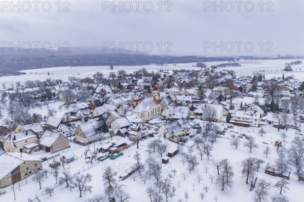 Overview of a snowy village in winter, central church, icy atmosphere, Wiesenstetten, Freudenstadt district, Germany