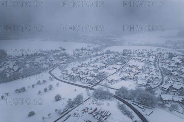 Snowy landscape with villages and fields under a foggy winter sky, Hörschweiler, Freudenstadt district, Germany