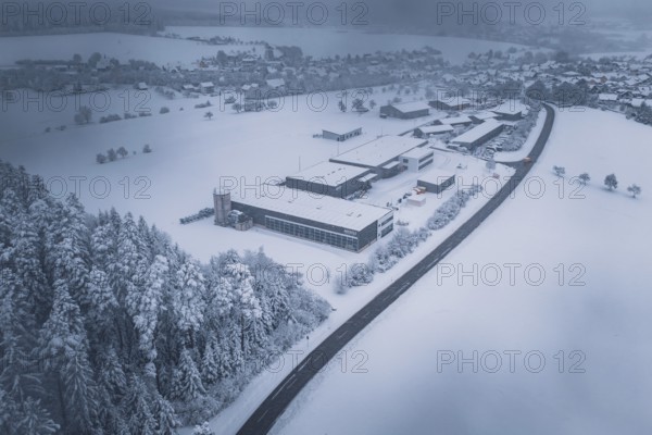 Snowy landscape with forest, surrounding villages and a factory in the foreground, Hörschweiler, Freudenstadt district, Germany