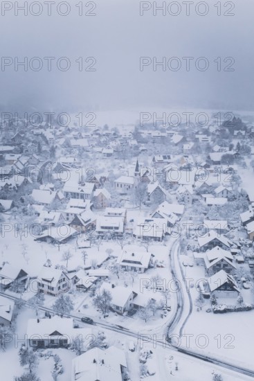 A wintry village with snow-covered houses and peaceful atmosphere, Schopfloch, Freudenstadt district, Germany