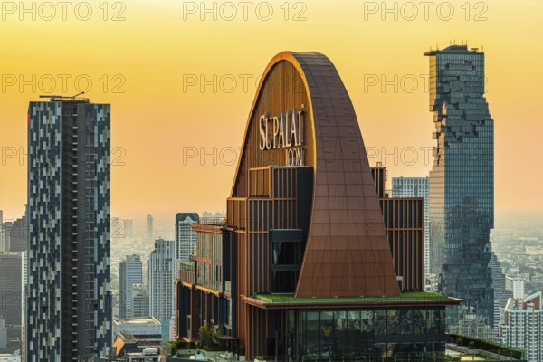 Over the rooftops of Bangkok, sunset, roof structure of the luxury residential residence Supalai Icon, view from the Moon Bar on the roof terrace of the Banyan Tree hotel, Sathon, Bangkok, Thailand's metropolis, Thailand
