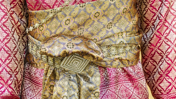Traditional Thai woman's clothing with tied sash, Bangkok, Thailand's metropolis, Thailand