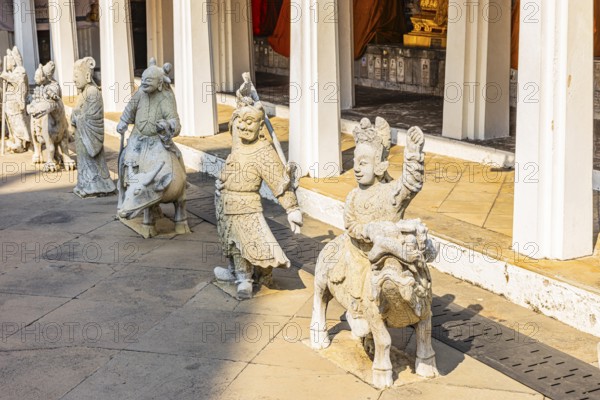 Mystical stone figures guard the Wat Arun Buddhist temple, Bangkok, Thailand's metropolis, Thailand