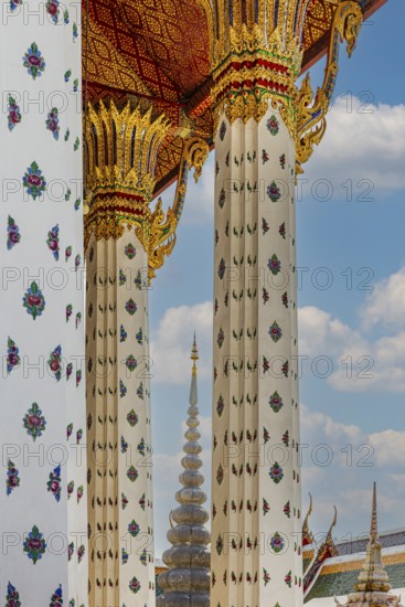 Columns with floral motifs support the gold-colored ceiling of the Wat Arun Buddhist temple, Bangkok, Thailand's metropolis, Thailand