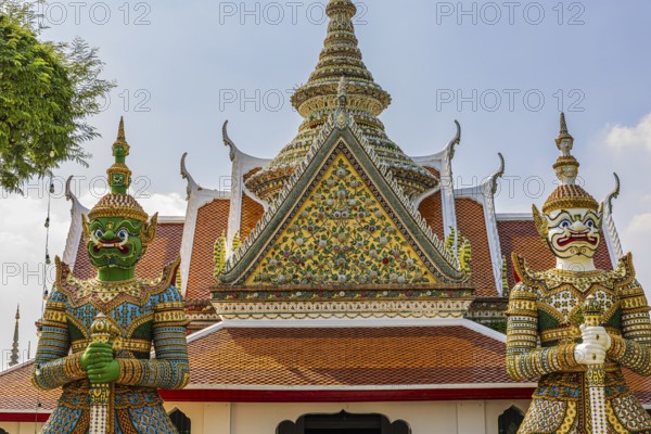 Wat Arun, guarded by mystical figures of Yaksha, Buddhist temple, overlapping roofs with Chedi temple tower, Bangkok, Thailand's metropolis, Thailand