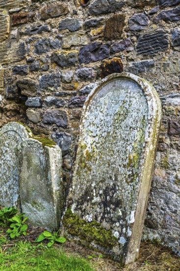 Church and cemetery over Borthwick Castle, Midlothian, Scotland, UK