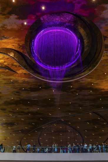 Artificial, brightly lit waterfall, Magic Waterfall, falls from the ceiling of the Iconsiam shopping center, Bangkok, Thailand's metropolis