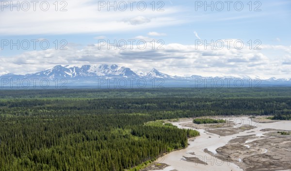 Copper River and Taiga landscape with forest, high mountain peaks in the back, Wrangell Mountains, Alaska, USA