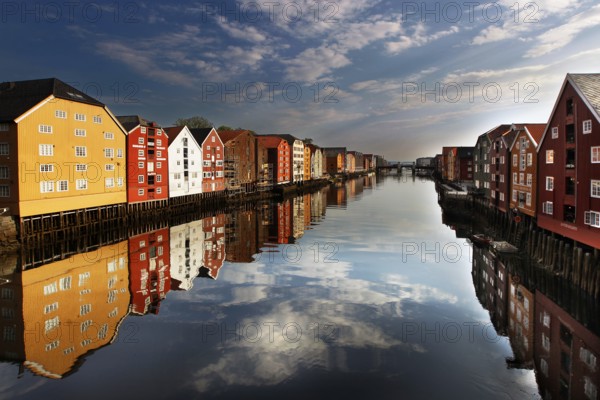 Storehouses along the Nidelva with perfect reflection in Trondheim, Trondheim, region, Norway