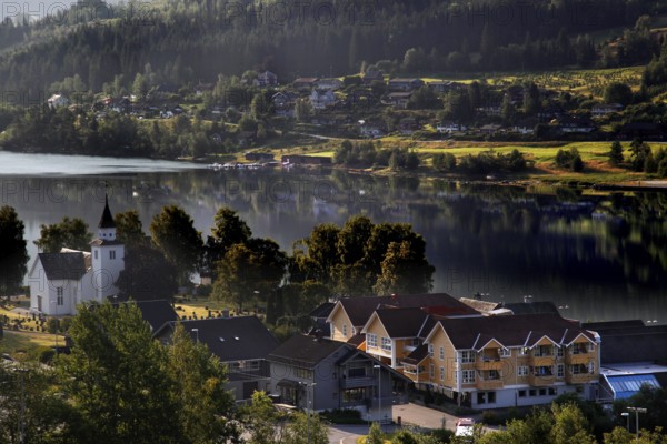 Idyllic village on the Hardangerfjord with a lakeside church, Ulvik, null, Norway