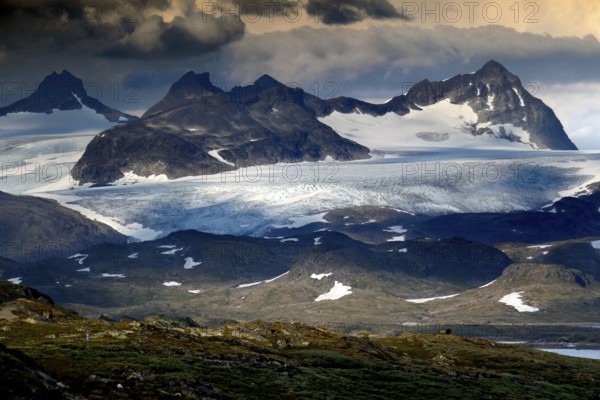 Impressive Skagastølstindane mountains and glaciers in the Sognefjell, partly covered by clouds, Sognefjell, Norway
